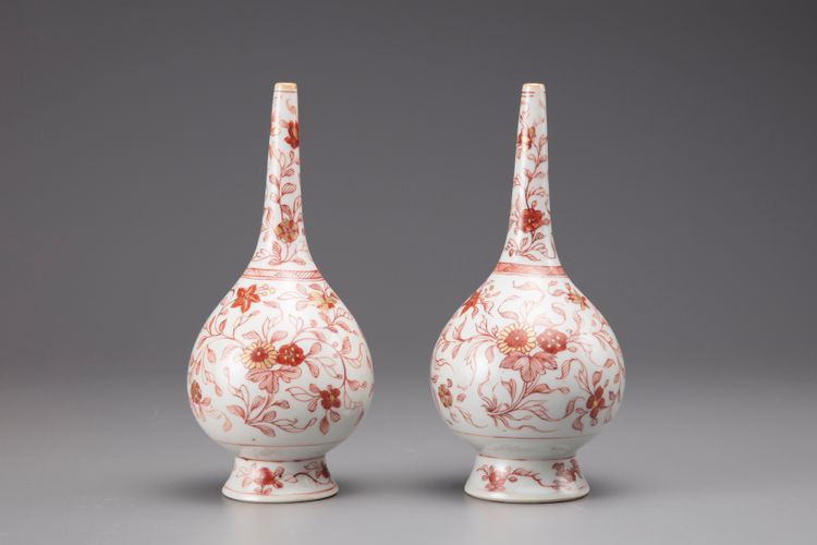 A pair of iron-red globular rosewater sprinklers