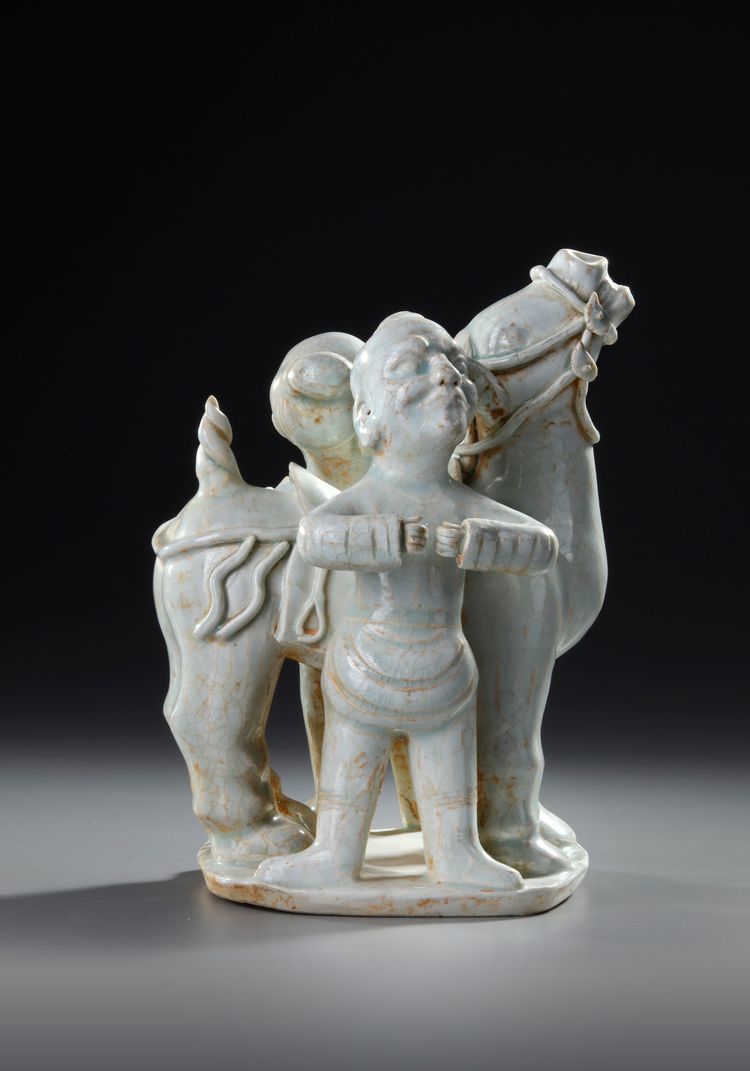 A CHINESE QINGBAI PORCELAIN HORSE WITH GROOMS, NORTHERN SONG DYNASTY (960–1127)