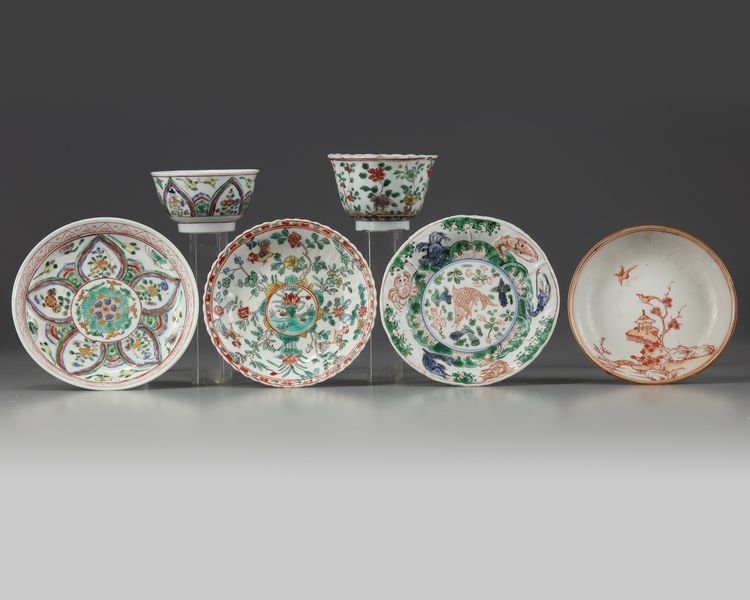 A group of Chinese iron-red-decorated and famille verte cups and saucers