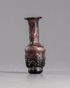 A ROMAN GLASS HEAD FLASK, CIRCA 3RD CENTURY AD
