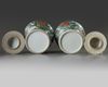 A pair of Chinese famille verte 'pheasants and peony' vases and covers