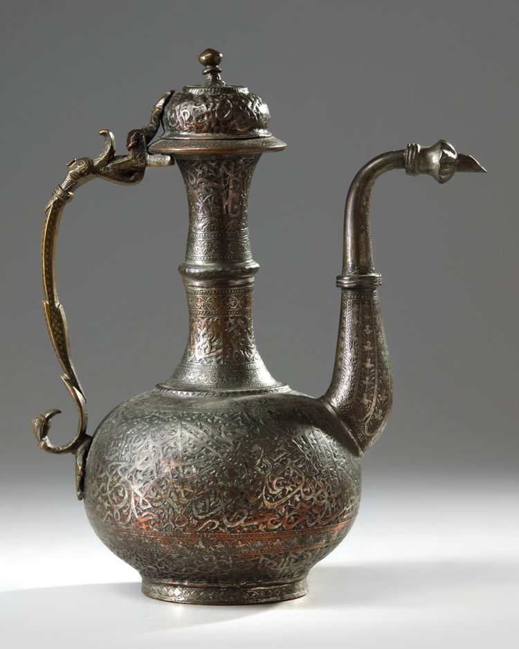 A TINNED COPPER CALLIGRAPHY EWER