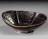 A CHINESE CIZHOU-TYPE BLACK-GLAZED INCISED FOLIATE BOWL, SONG DYNASTY (960-1279)