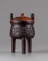 A CHINESE HARDWOOD ARCHAISTIC TRIPOD CENSER AND COVER, 19TH CENTURY