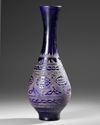 A COBALT BLUE WHEEL-CUT AND ENGRAVED GLASS BOTTLE,MESOPOTAMIA, 10TH–12TH CENTURY