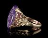 A ROMAN INTAGLIO IN AMETHYST WITH A FOOT OF MERCURY AND BUTTERFLY MOUNTED IN A 19TH CENTURY RING, INTAGLIO 1ST CENTURY BC-AD