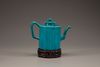 A turquoise-glazed wine pot and cover