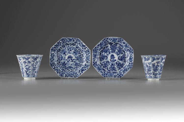 A pair of octagonal blue and white cups and saucers