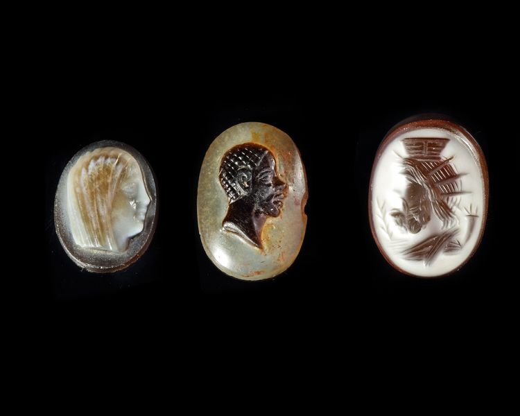 AN INTAGLIO OF SERAPIS, A CAMEO OF AN AFRICAN, A CAMEO OF A YOUTH OR WOMAN, 19TH CENTURY AND EARLIER