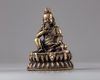 A bronze seated figure
