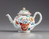 A Chinese famille rose moulded teapot and cover
