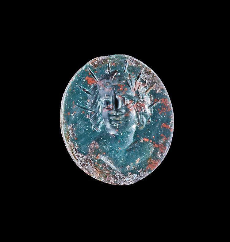 AN INTAGLIO WITH A BUST OF SOL, 1ST-2ND CENTURY AD