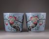A pair of Chinese blue-ground famille rose 'nine peach' jardinieres
