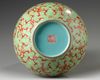 A Chinese lime green ground iron red decorated double gourd vase
