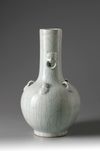 A large pale turquoise crackle-glazed bottle vase