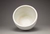 A white-glazed 'lotus' jardiniere