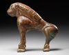 A BRONZE FATIMID MIRROR HANDLE IN THE FORM OF A LION, 11TH CENTURY