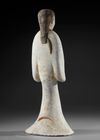 A LARGE TERRACOTTA STATUE OF A STANDING FEMALE ATTENDANT, CHINA, HAN DYNASTY (206 BC-206 AD)