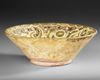A NISHAPUR SLIP-PAINTED POTTERY BOWL, PERSIA 10TH-11TH CENTURY