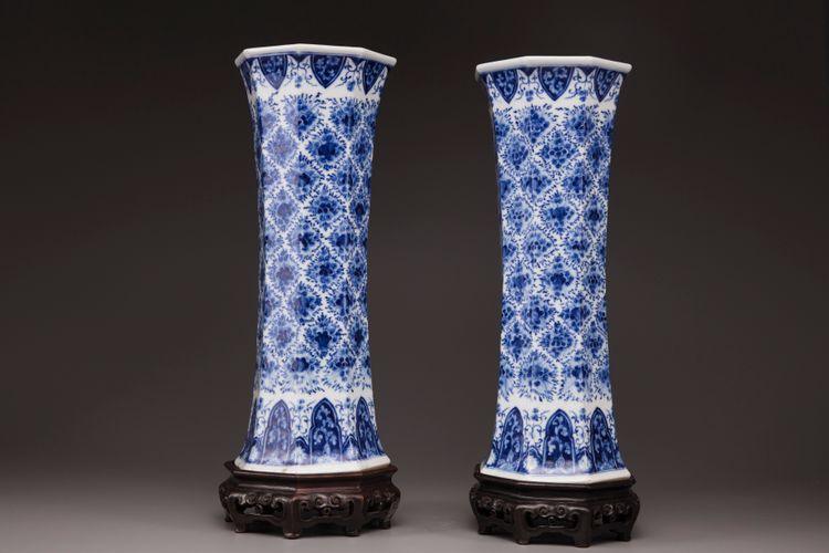 A pair of blue and white trumpet vases
