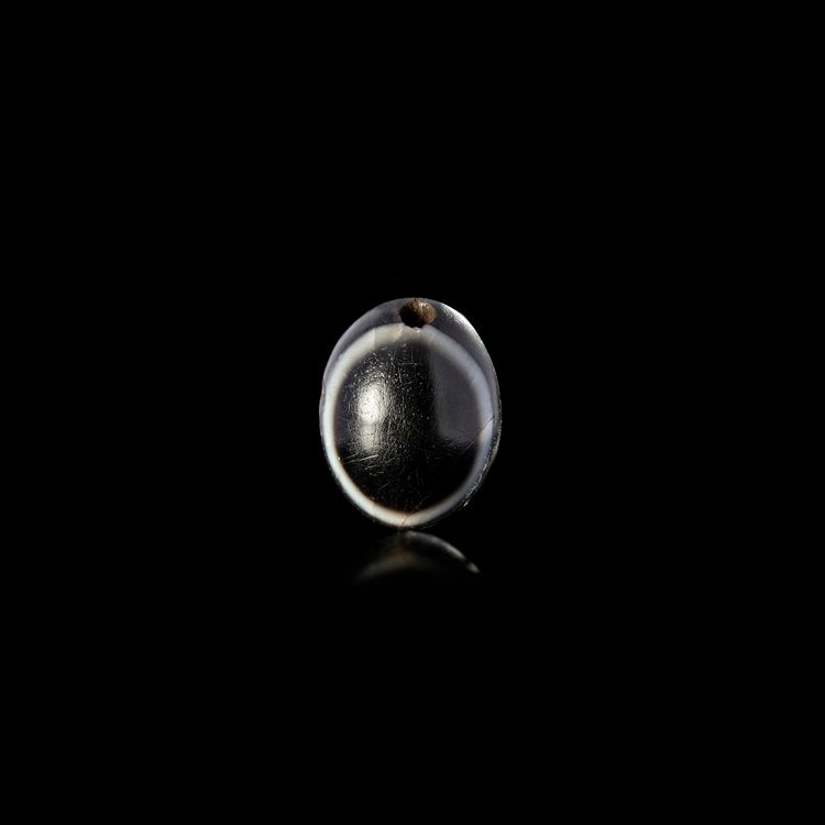 AN AGATE EYE BEAD. 5th.c.B.C.