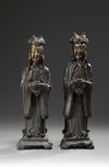 A pair of Chinese parcel gilt bronze standing scholars