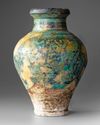 A RAQQA TURQUOISE AND BLACK GLAZED POTTERY VASE, SYRIA 12TH-13TH CENTURY