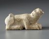 A WESTERN ASIATIC ELAMITE AMULET LIMESTONE WITH LION SEATED, CIRCA 2ND-1ST MILLENNIUM  B.C.