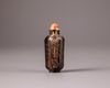 A Chinese smokey-quartz hexagonal inscribed snuff bottle