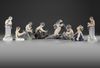 A SET OF 8 ROYAL COPENHAGEN FAUN FIGURINES, MID 20TH CENTURY