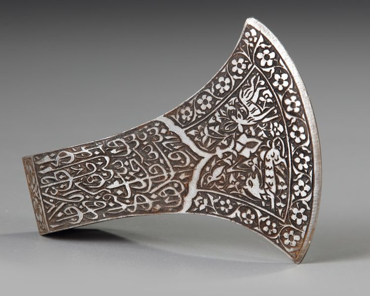 A SILVER INLAID METAL AXE HEAD, 20TH CENTURY