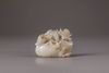 A white and russet jade 'mandarin ducks and lotus' carving