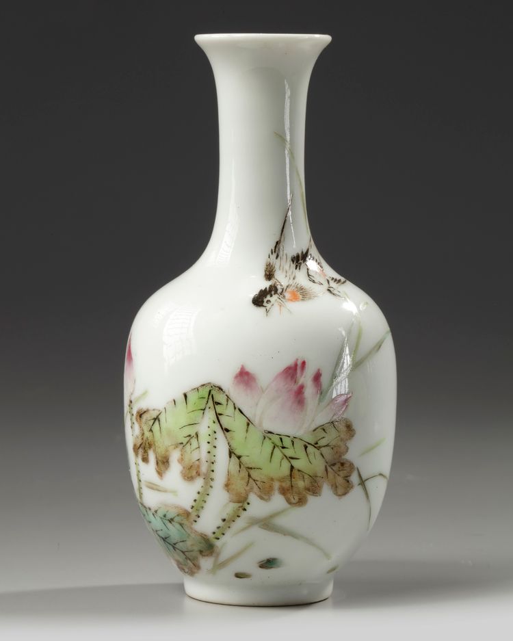 A small Chinese famille rose 'bird and lotus' bottle vase
