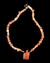 A CARNELIAN BEAD TURTLE NECKLACE