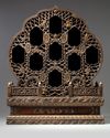 A Chinese hardwood parcel-gilt foliate altar cabinet