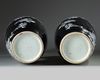 A pair of Chinese black-ground enamelled 'magpie and prunus' vases
