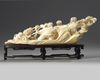 A Chinese carved ivory 'children and vegetable' carving