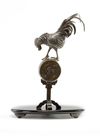 A Japanese figure of a rooster on a stand