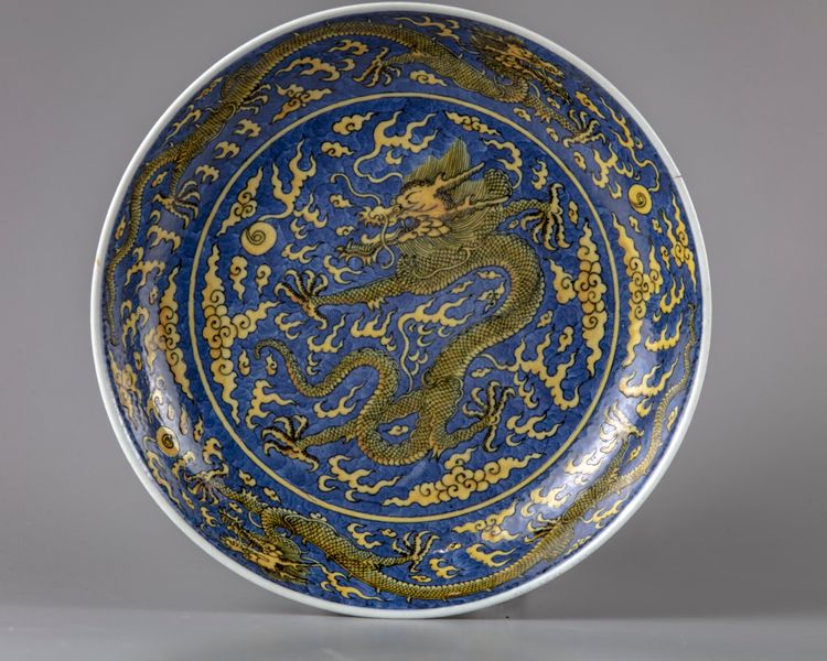 A blue-ground yellow enamelled 'dragon' dish