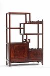 A small Chinese hardwood ‘dragon’ display cabinet