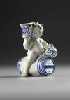 A BLUE AND WHITE BACCHUS ON A WINE BARREL, PROBABLY BRUSSELS 18TH CENTURY