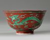 A Chinese red-ground green-enamelled 'dragon' bowl