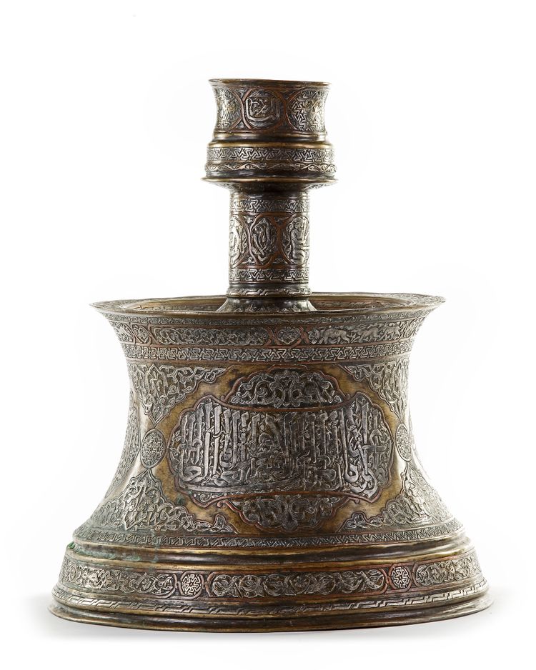 A LARGE MAMLUK STYLE SILVER INLAID BRASS CANDLESTICK, 19TH CENTURY