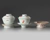 Two Chinese cups, covers, and saucers and a stem dish