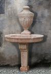 A CARVED BROCATELLE ROUGE MARBLE WALL FOUNTAIN, 18TH CENTURY
