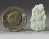 A Chinese celadon jade pommel and a pale celadon jade monkey