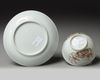 A Chinese famille rose ‘bird and flower’ cup and saucer