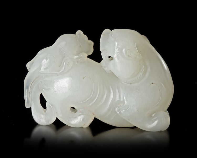 A CHINESE JADE CARVED BUDDHIST LION, 20TH CENTURY