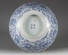 A Chinese blue and white foliate-rimmed 'nine dragon' bowl