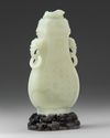 A Chinese pale celadon jade vase and cover
